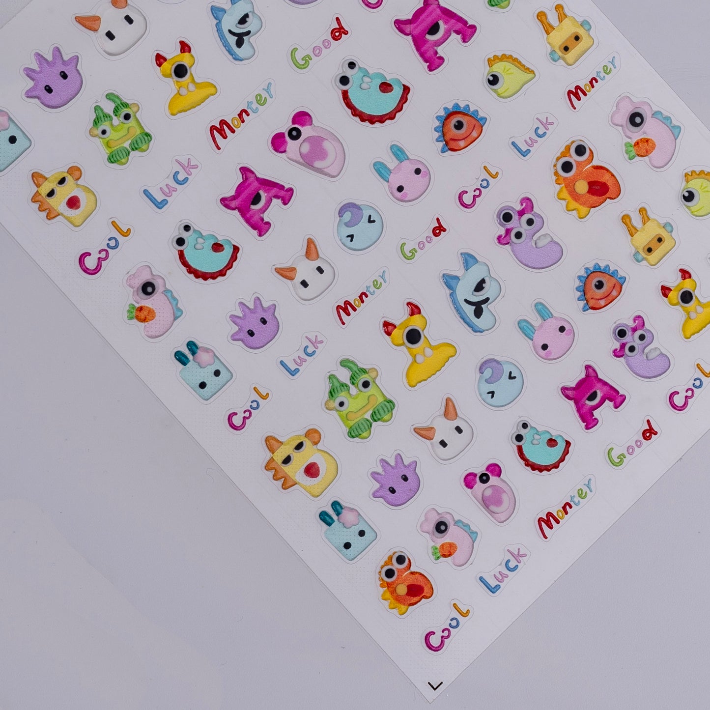 Sheet of colorful stickers with various designs and text on a white background