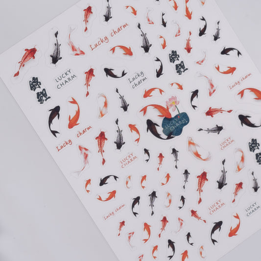 Sheet of nail stickers with koi fish designs and 'Lucky Charm' text on a white background.