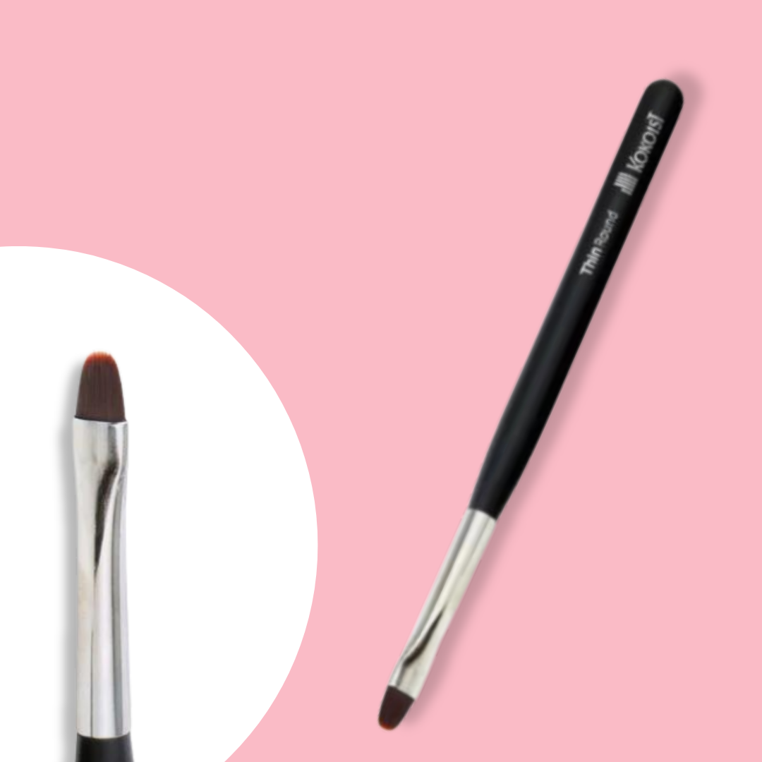 A thin round brush with a black handle and synthetic bristles, designed for gel application, displayed on a pink background.