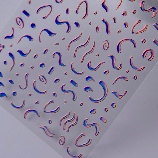 Detail view of nail decal sheet on light background.