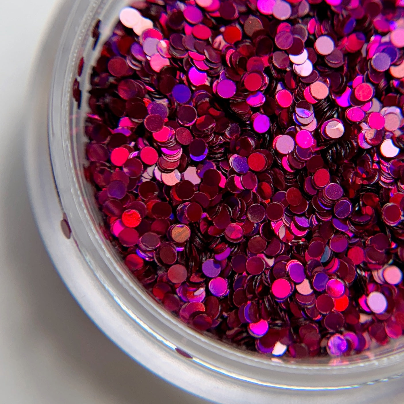 Close up of chunky glitter in clear container.