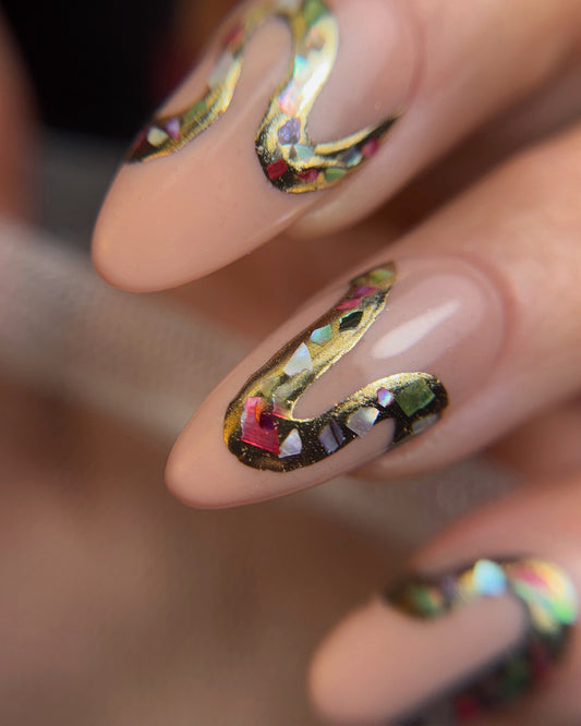 Nails with colorful, decorative design on a blurred background