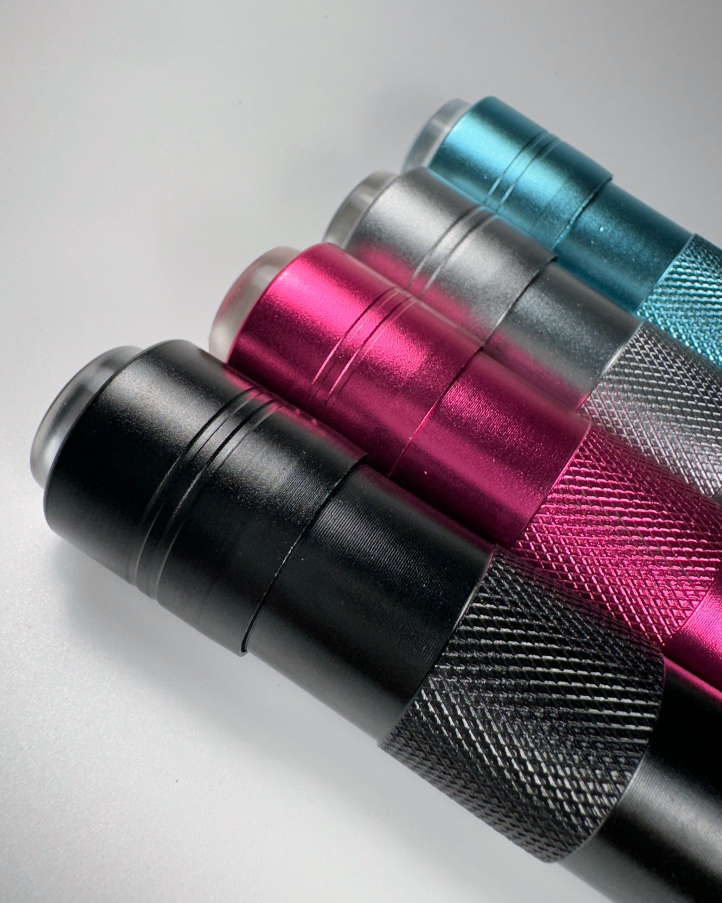 Row of flash cure lights in multiple colors on white background