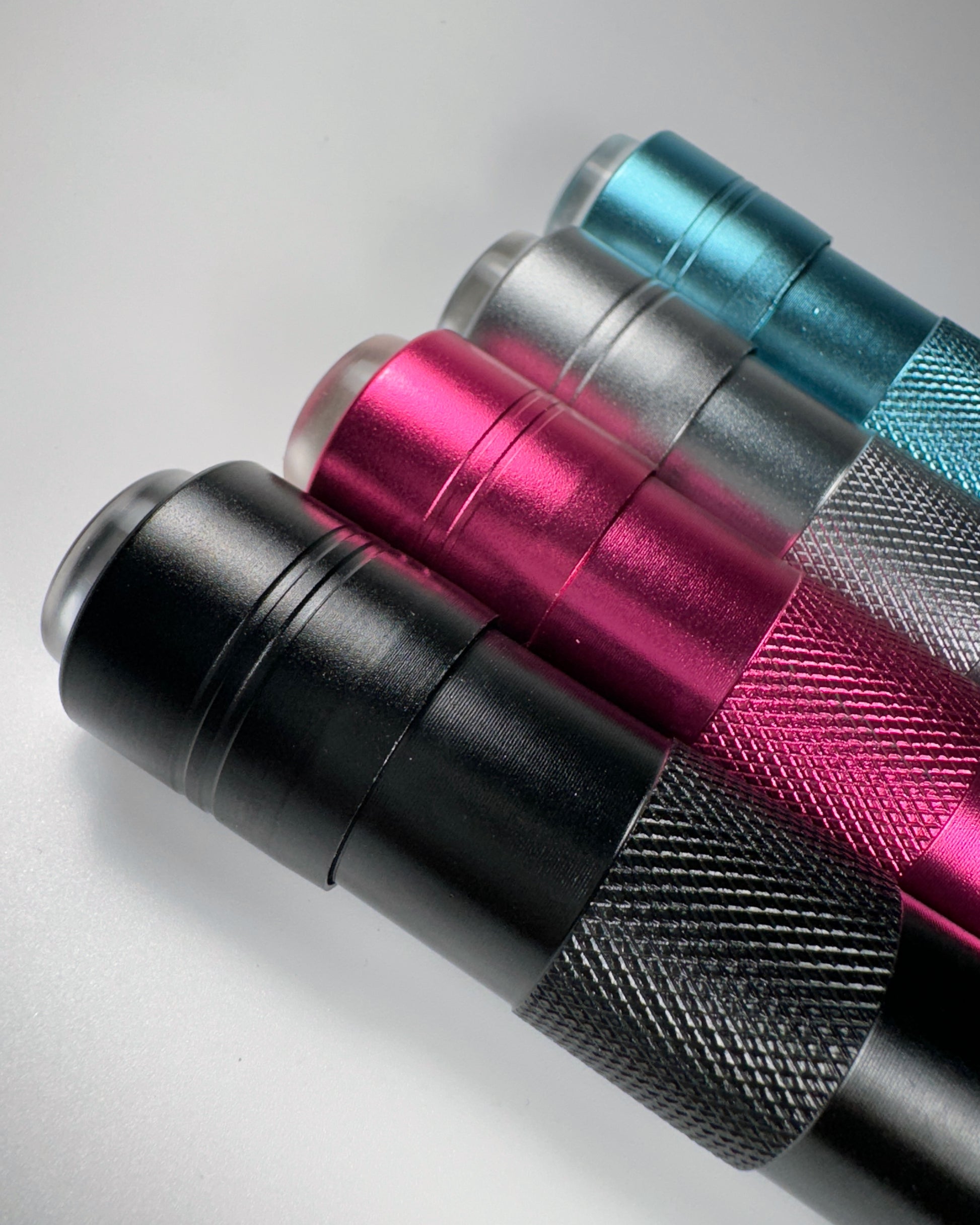 Row of flash cure lights in multiple colors on white background