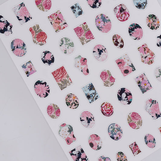 Sheet of floral nail art stickers on a white background