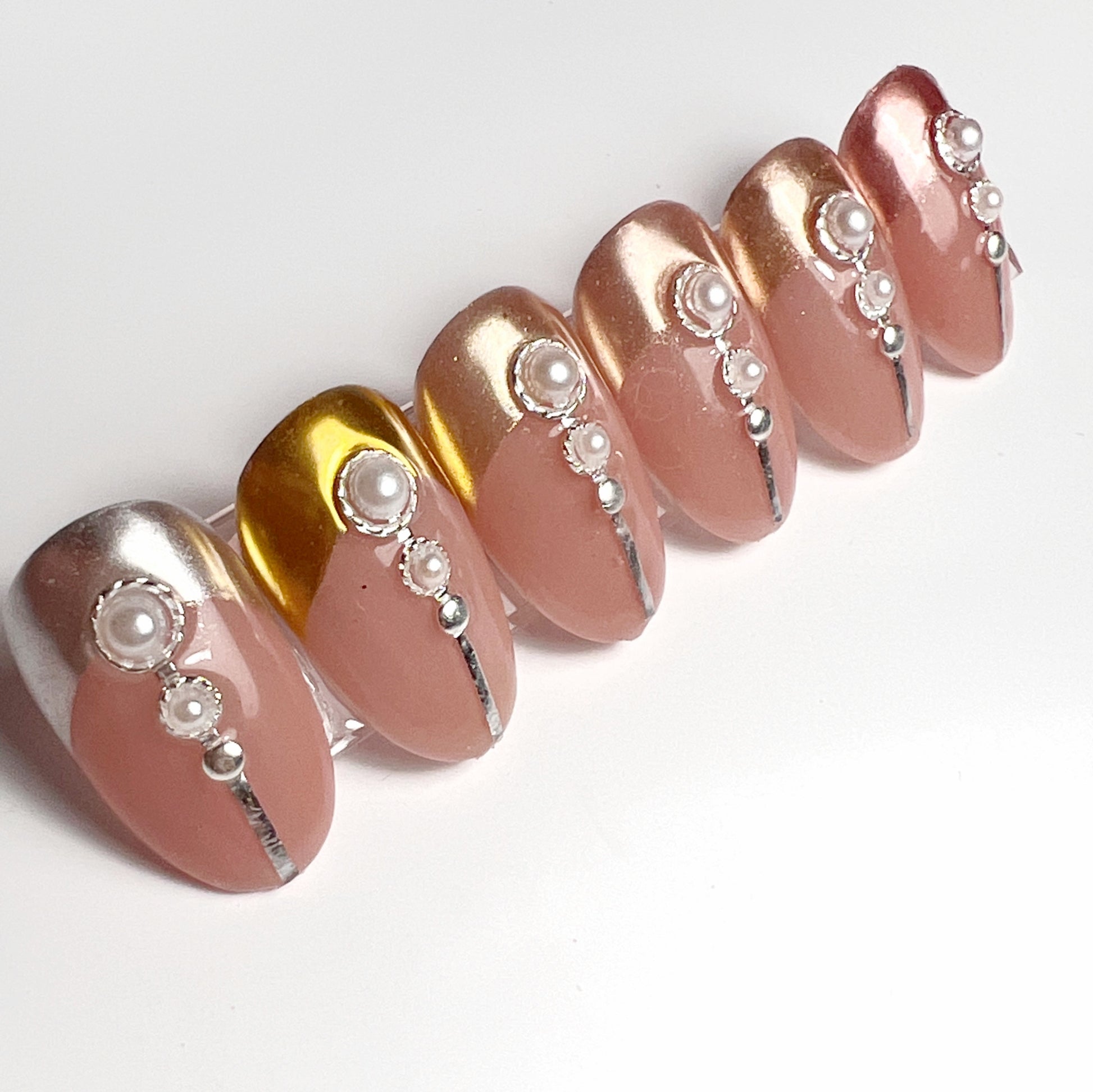 Decorated nail tips on white background. 