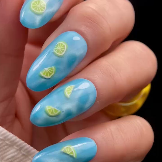 Video of blue nails with lemon slice design