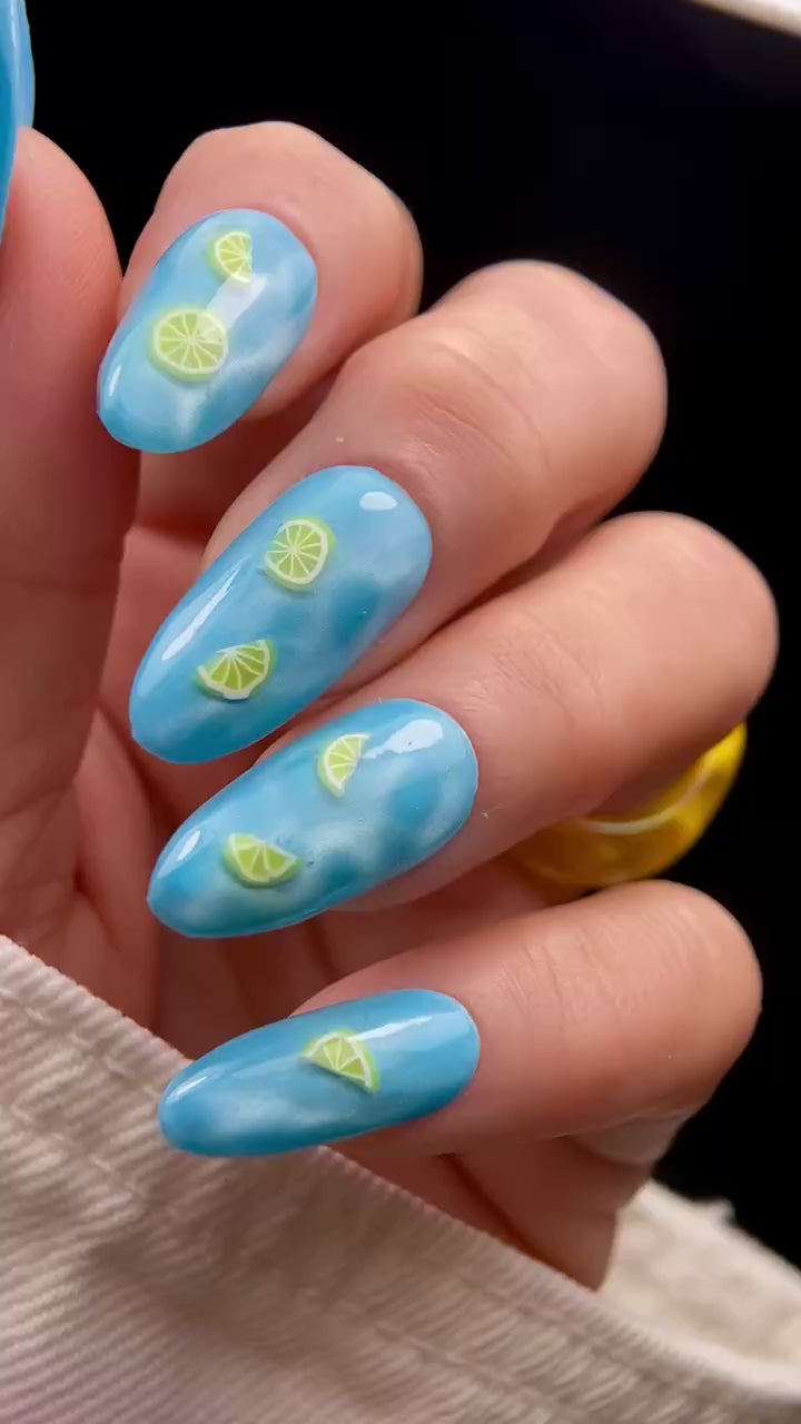 Video of blue nails with lemon slice design