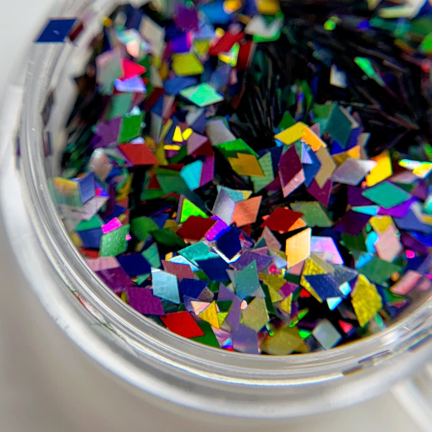 Close up of star glitter in clear container.