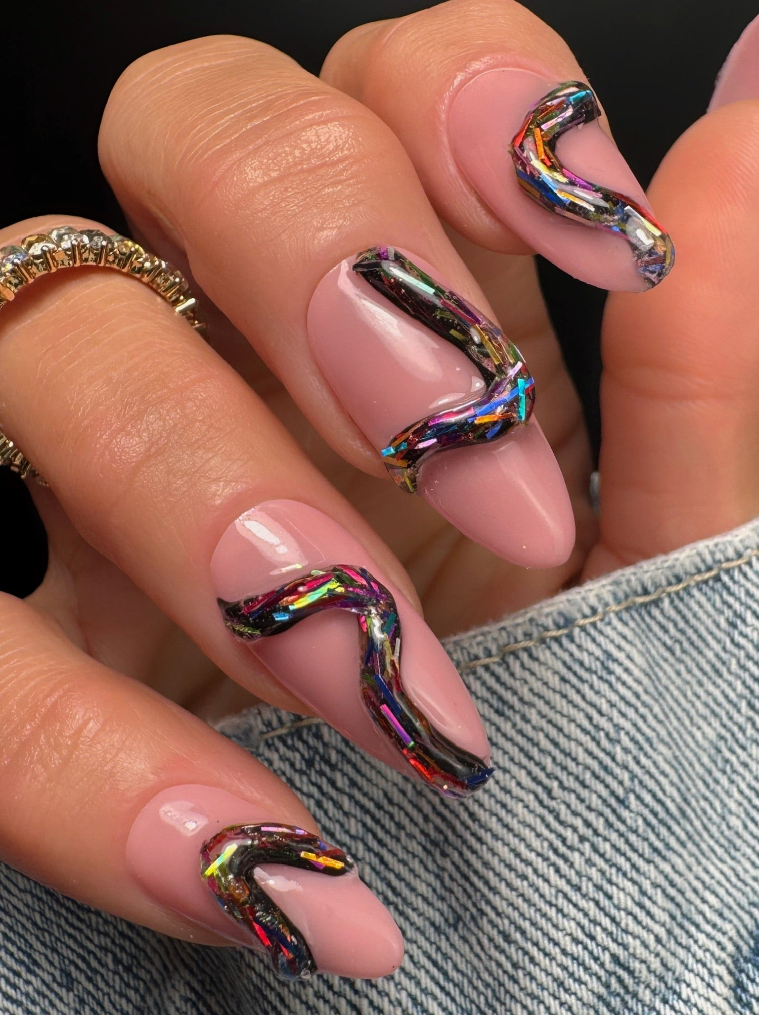 Nails with colorful 3D design on a black background