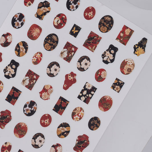 Sheet of decorative stickers with floral patterns on a white background