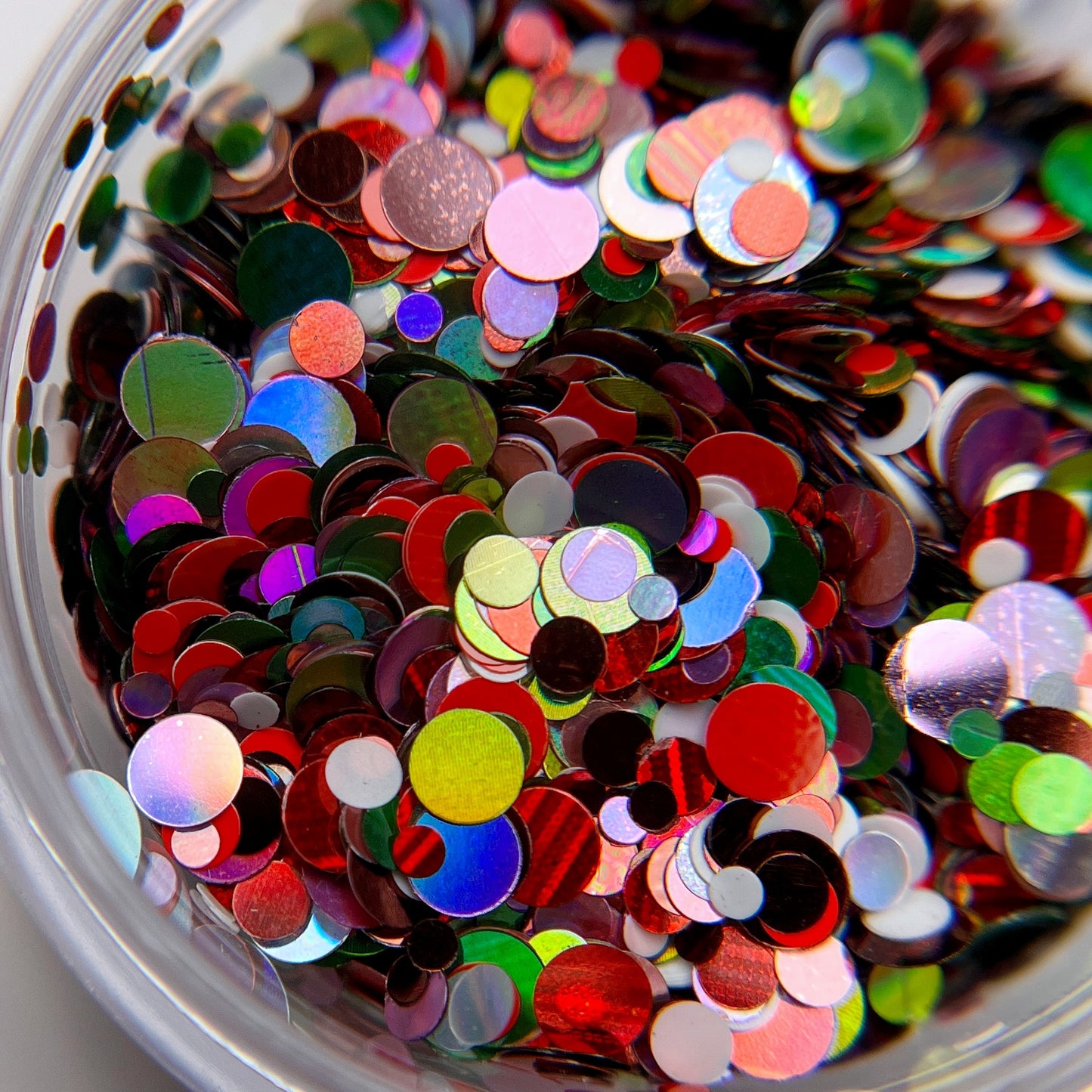 Close up image of multicolor glitter in transparent jar