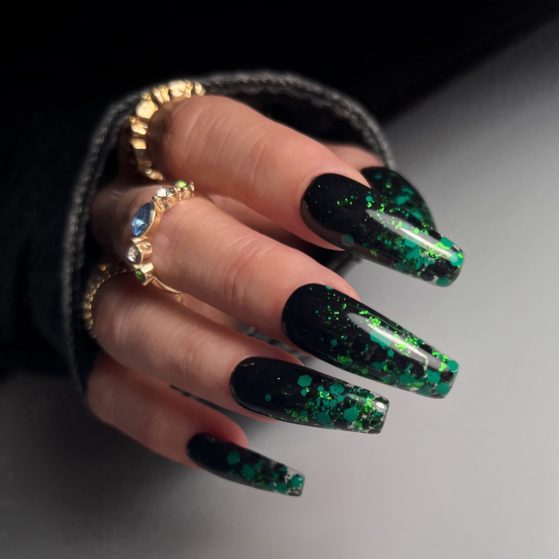 Nail art example on long black nails. 