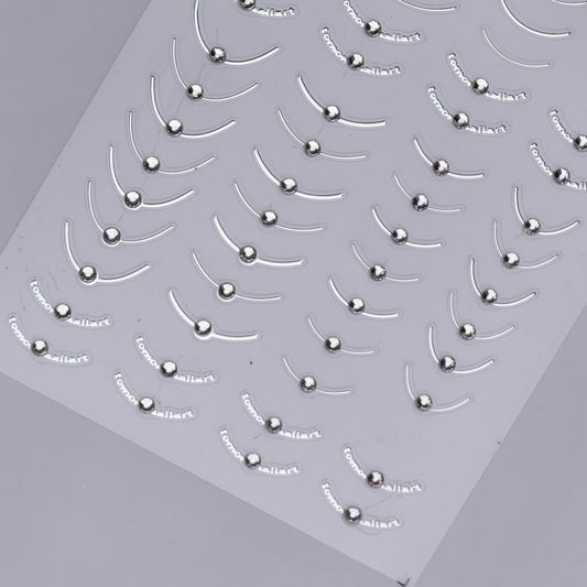 Detail view of nail decal sheet on light background.