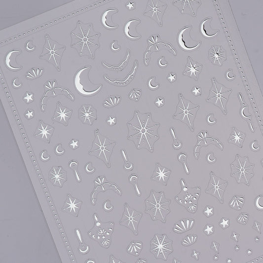 Sheet of star and moon-shaped stickers on a gray background