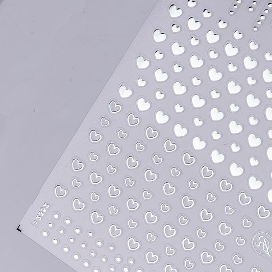 Detail view of nail decal sheet on light background.