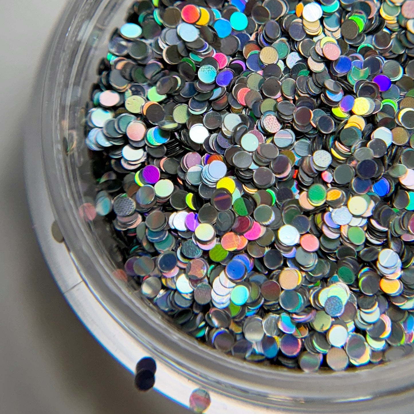 Close up of glitter in clear container.