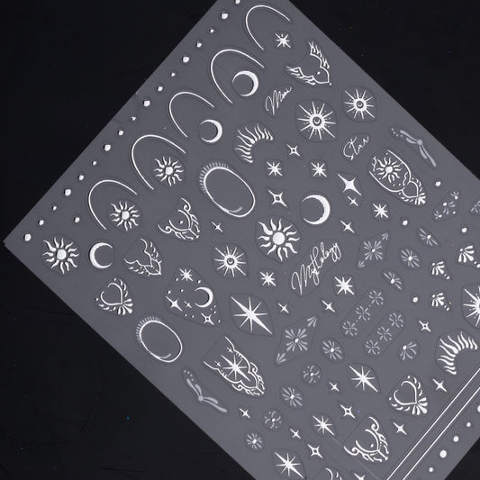 Detail view of nail decal sheet on dark background.