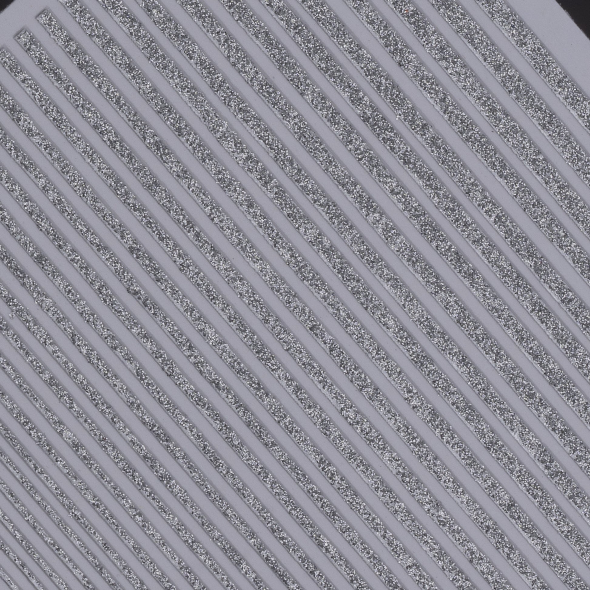 Close-up view of glitter line nail stickers on white background.