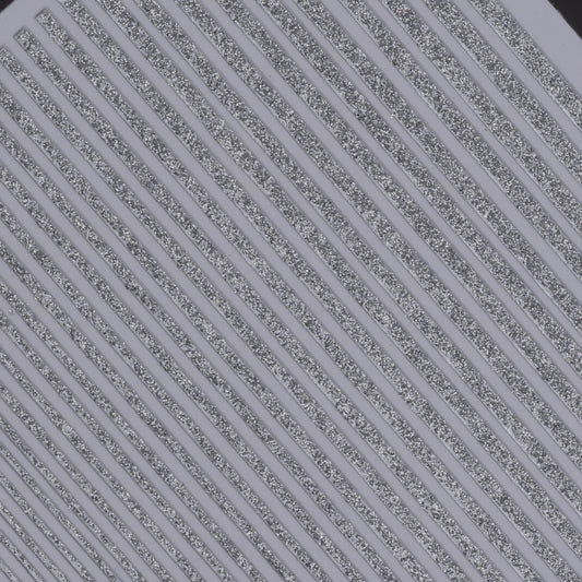 Close-up view of glitter line nail stickers on white background.