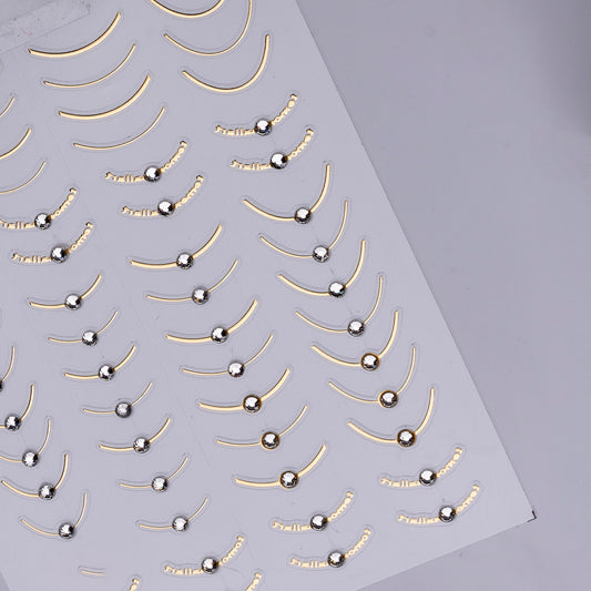 Detail view of nail decal sheet on light background.