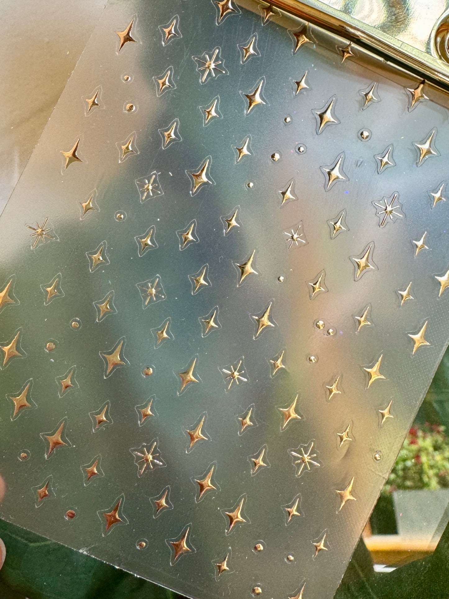 Sheet of star-shaped stickers on a clear background