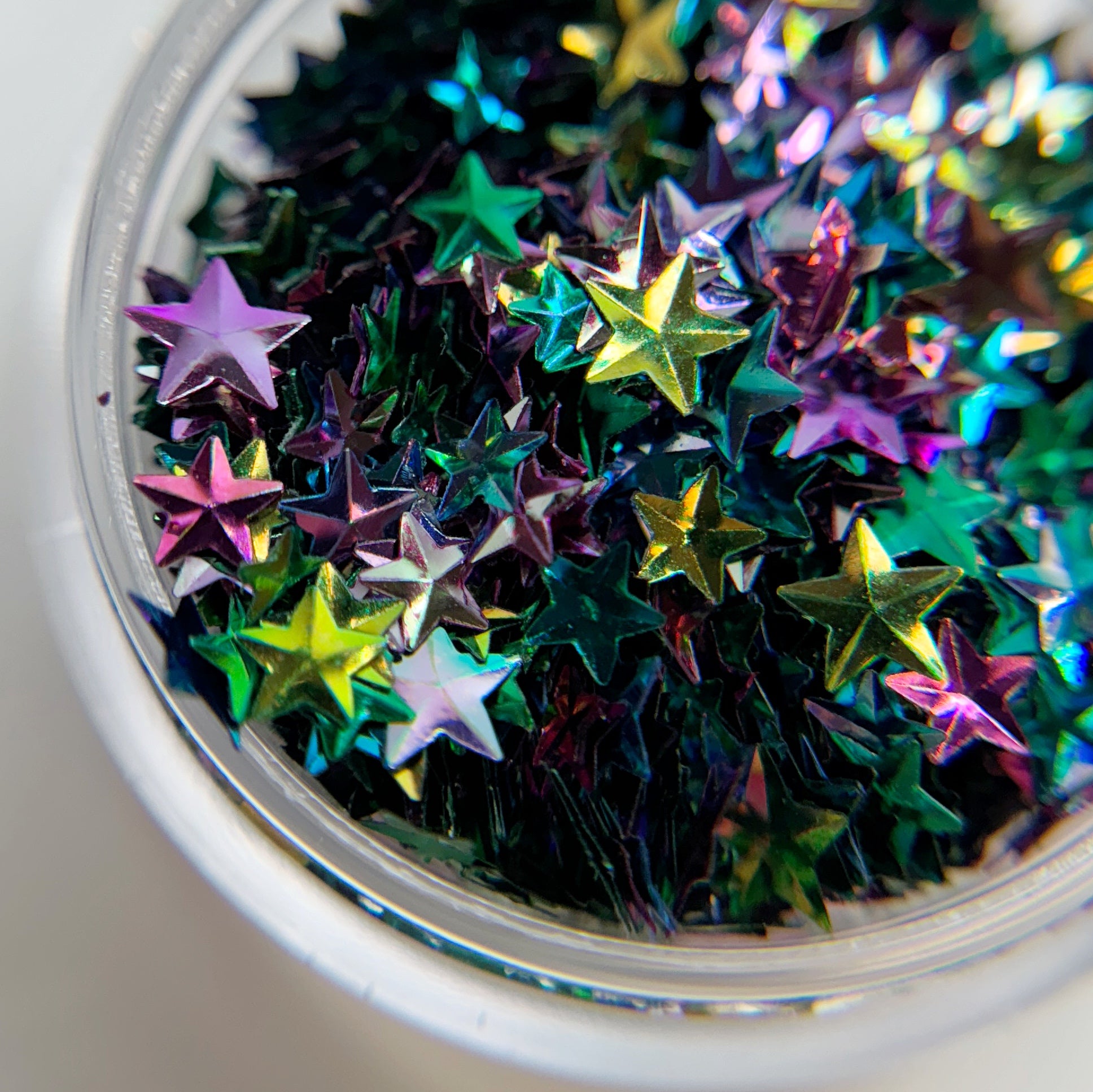 Close up of star glitter in clear container.