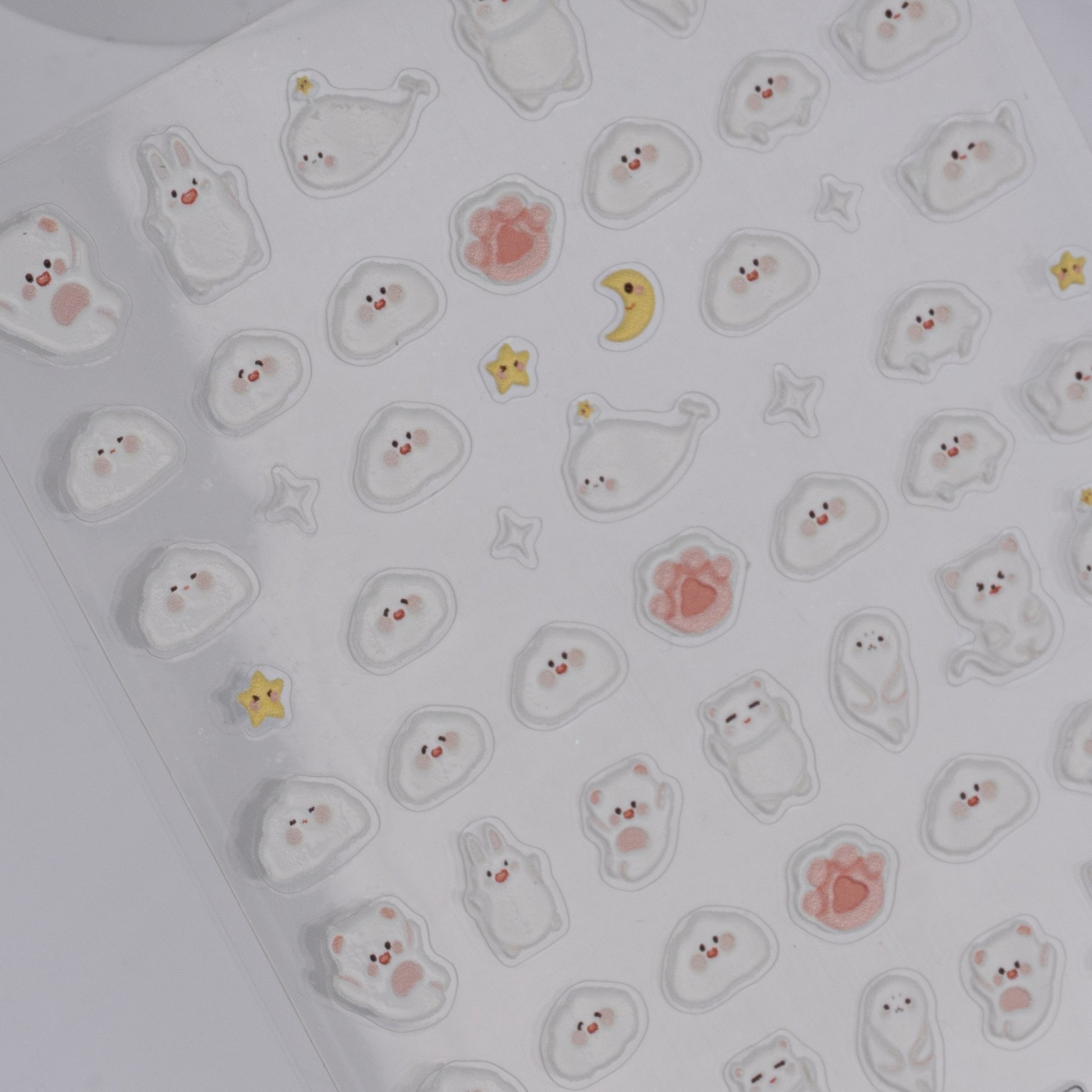 Sheet of small, cute animal stickers on a white background
