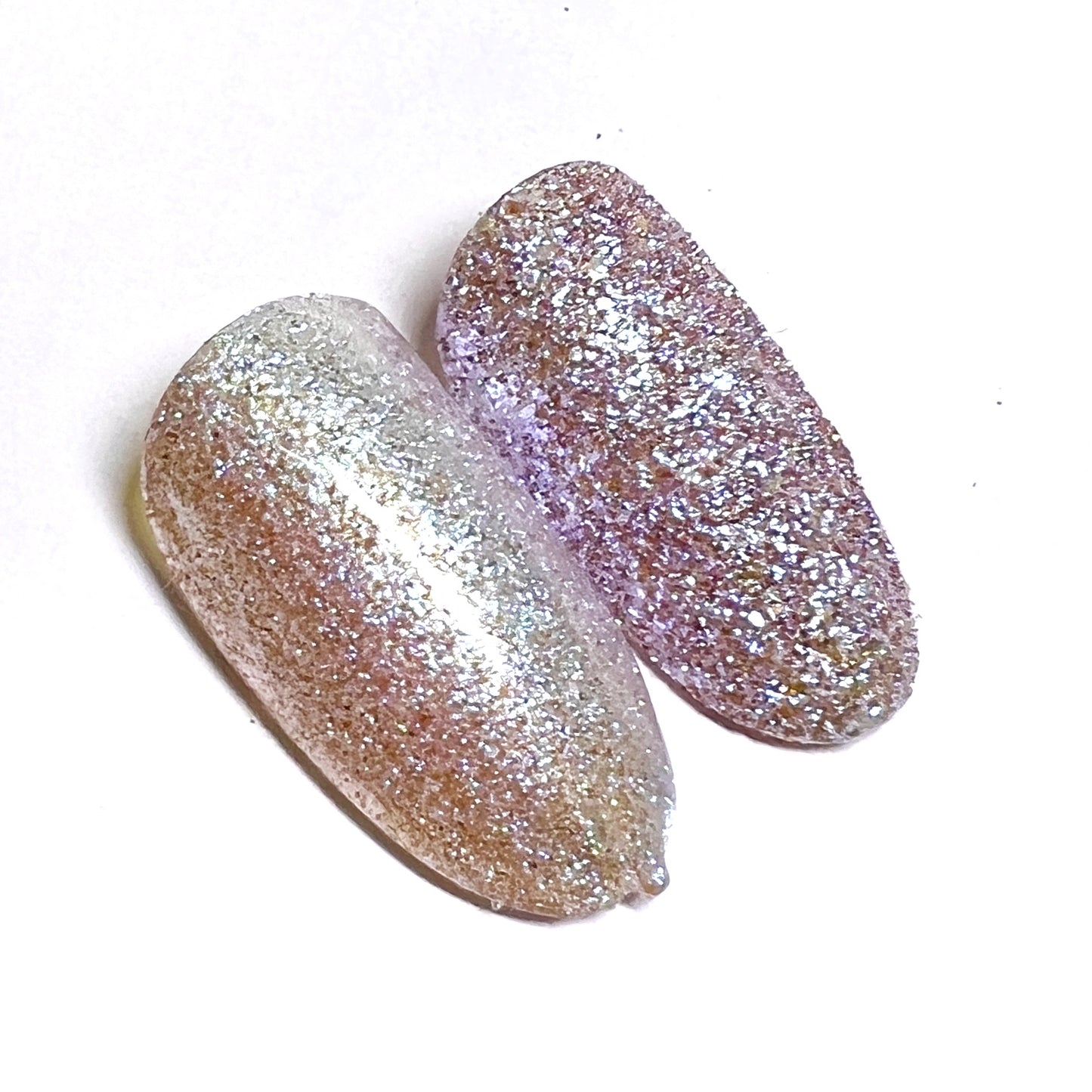 Decorated nail tips on white background. 