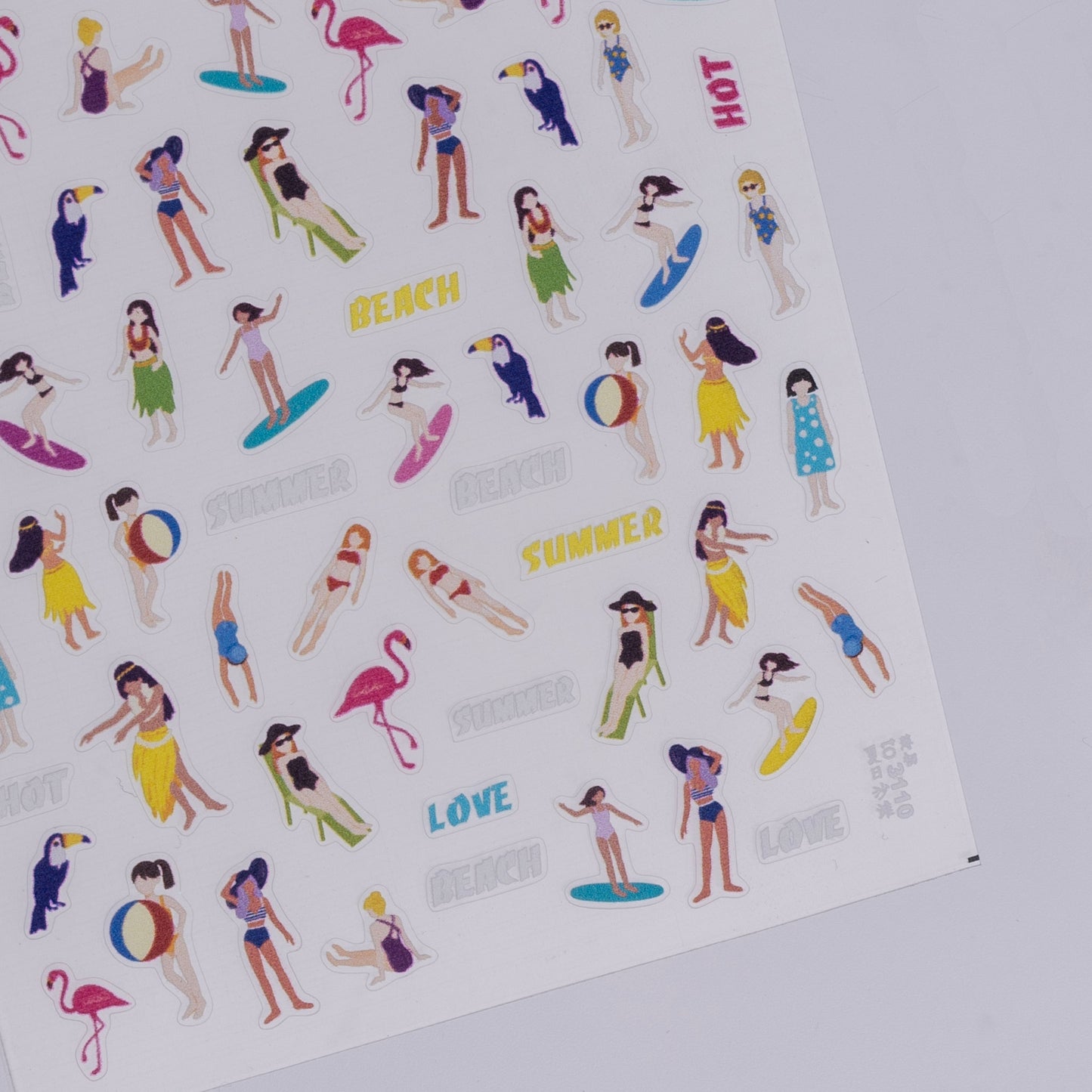 Sheet of beach-themed stickers with people, flamingos, and text on a white background