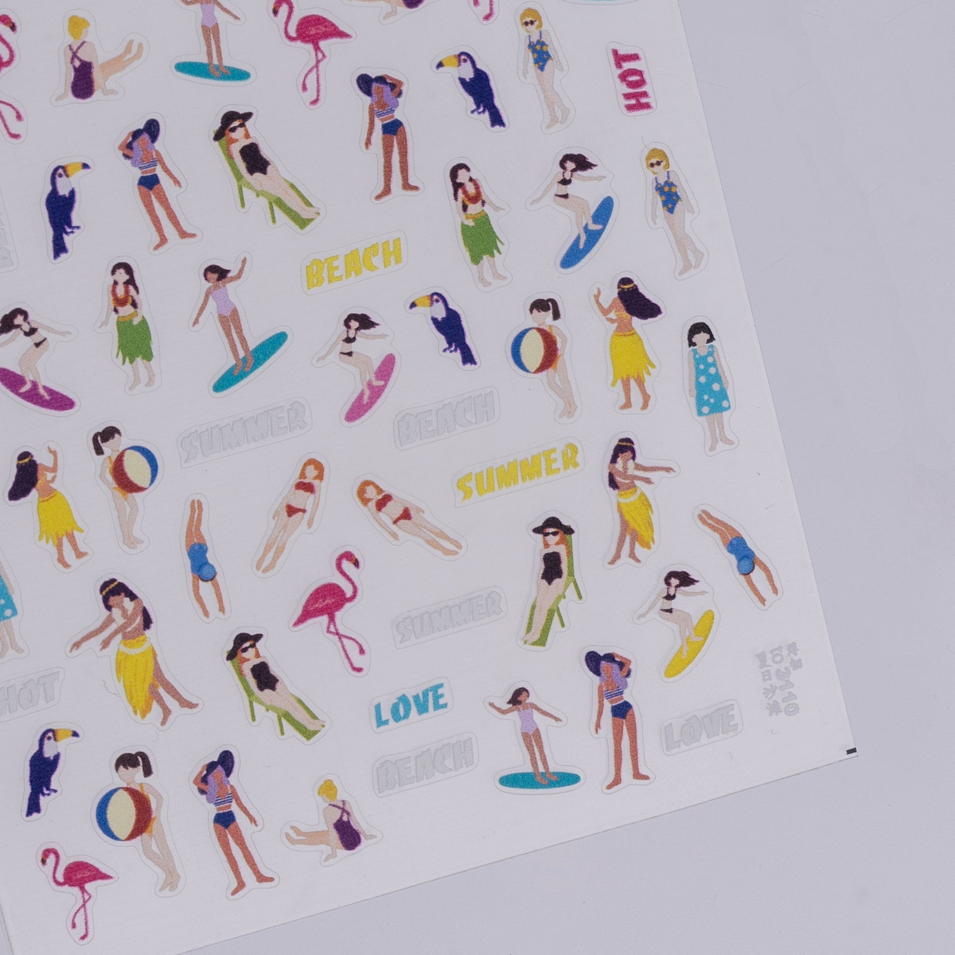 Sheet of beach-themed stickers with people, flamingos, and text on a white background