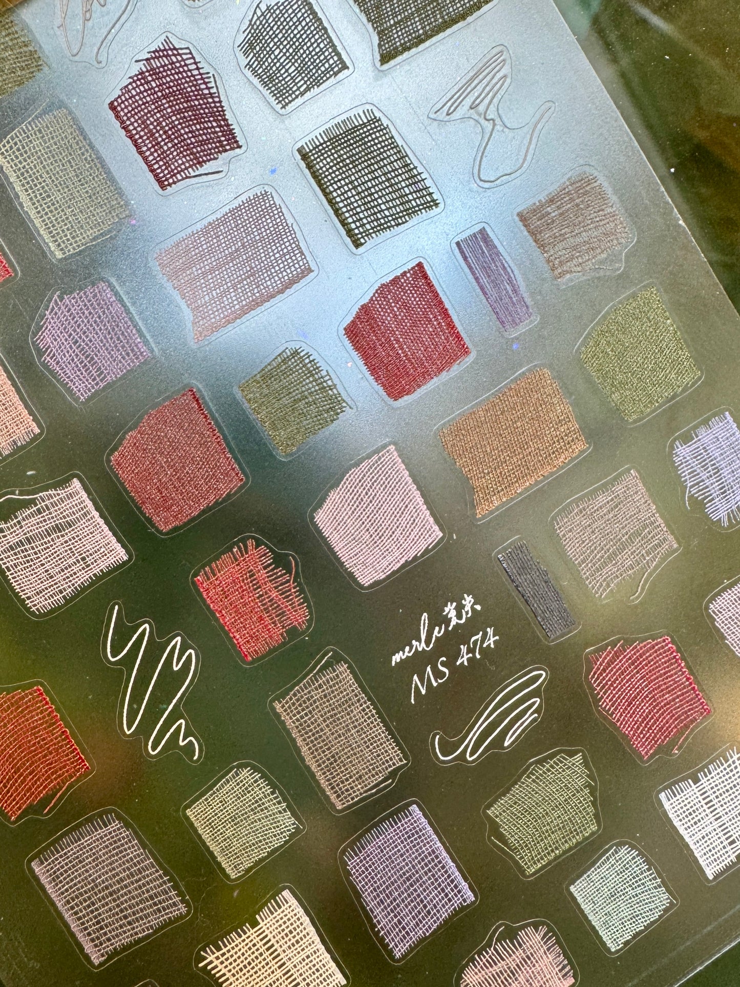 Sheet of nail decals on transparent backing 