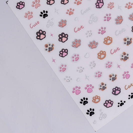 Sheet of colorful paw print stickers with 'Cat' text on a white background