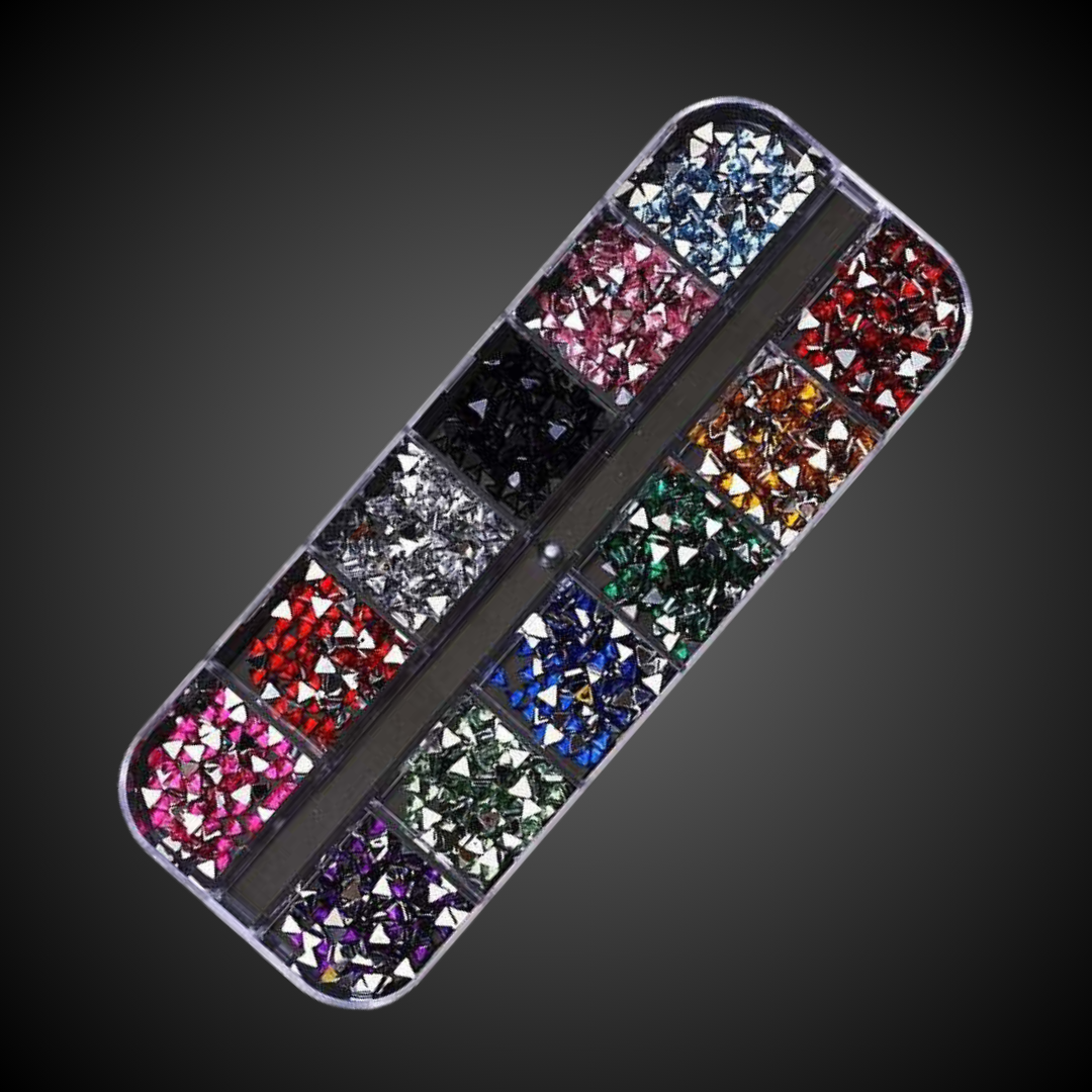 Nail art rhinestone set with multicolored stones on a dark background