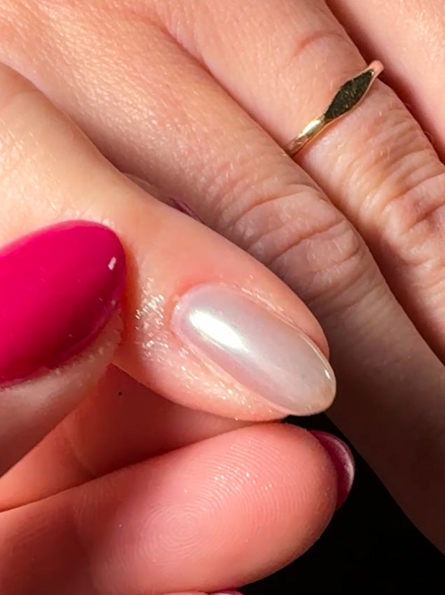 Close up of finger with metallic nail 