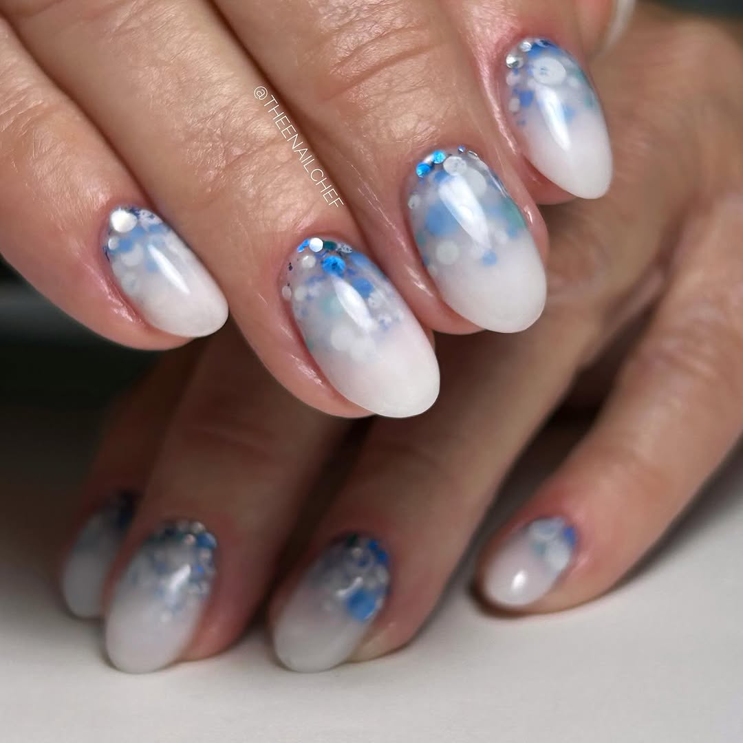 Close up of white and blue nail design 