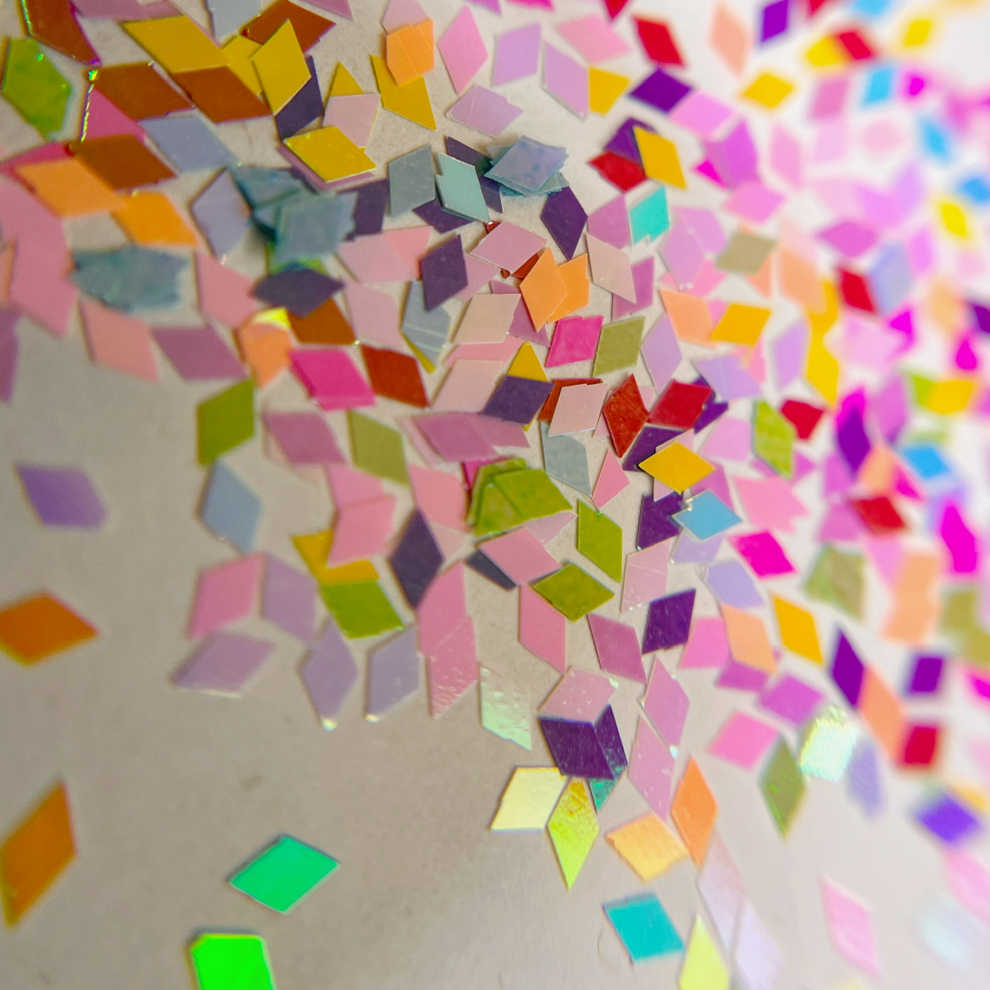 Glitter mix scattered on white background,