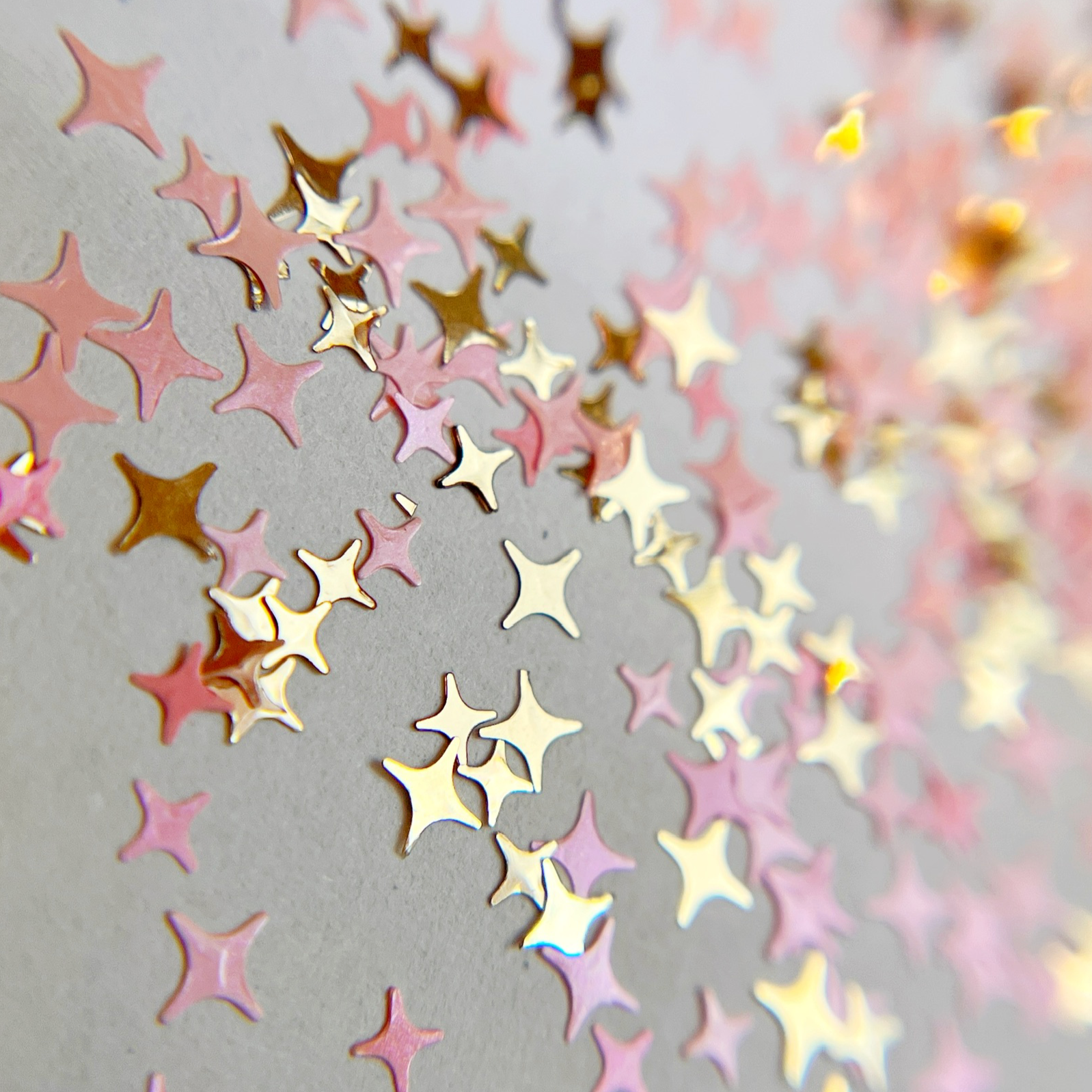 Glitter mix scattered on white background. 