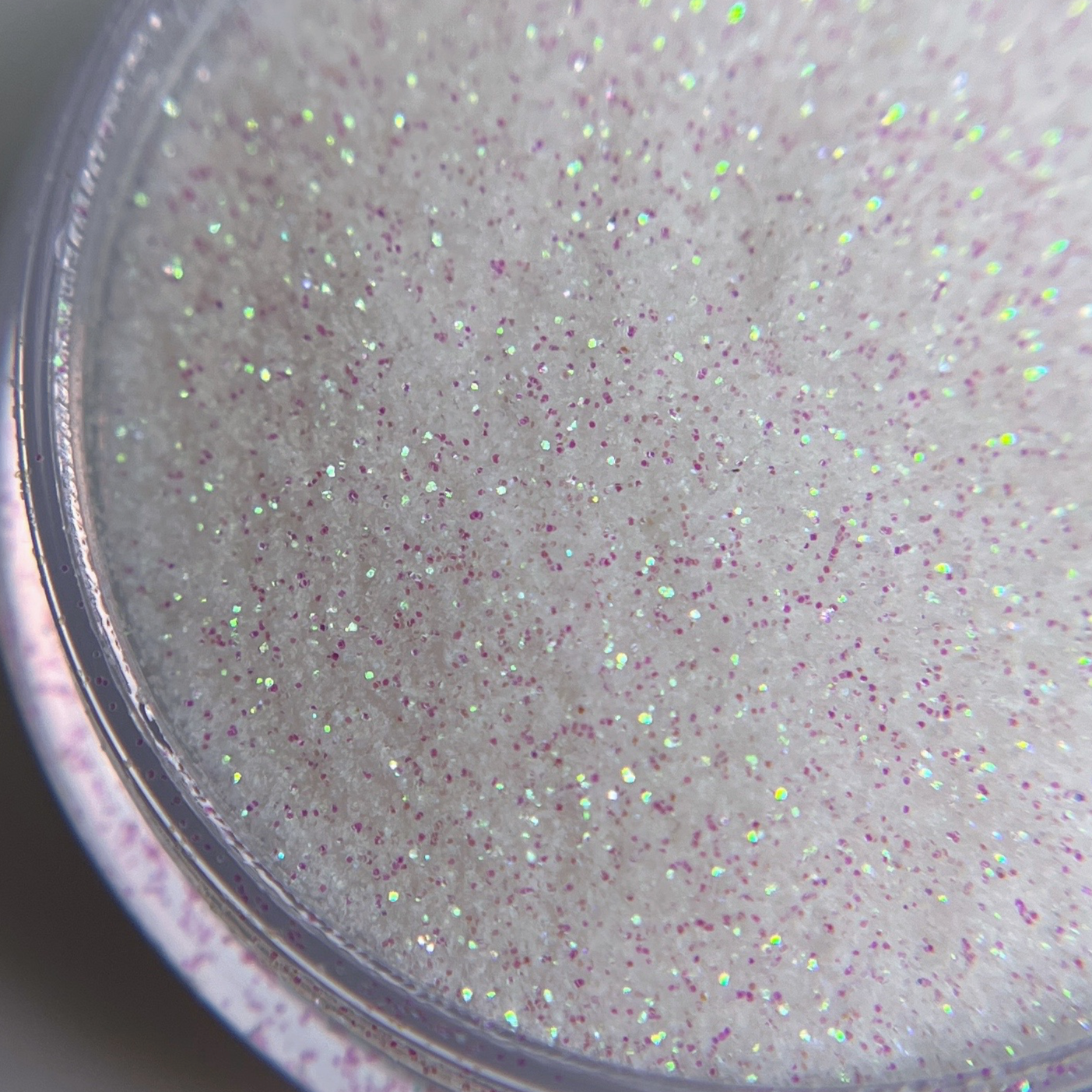 Close up of fine glitter in transparent jar