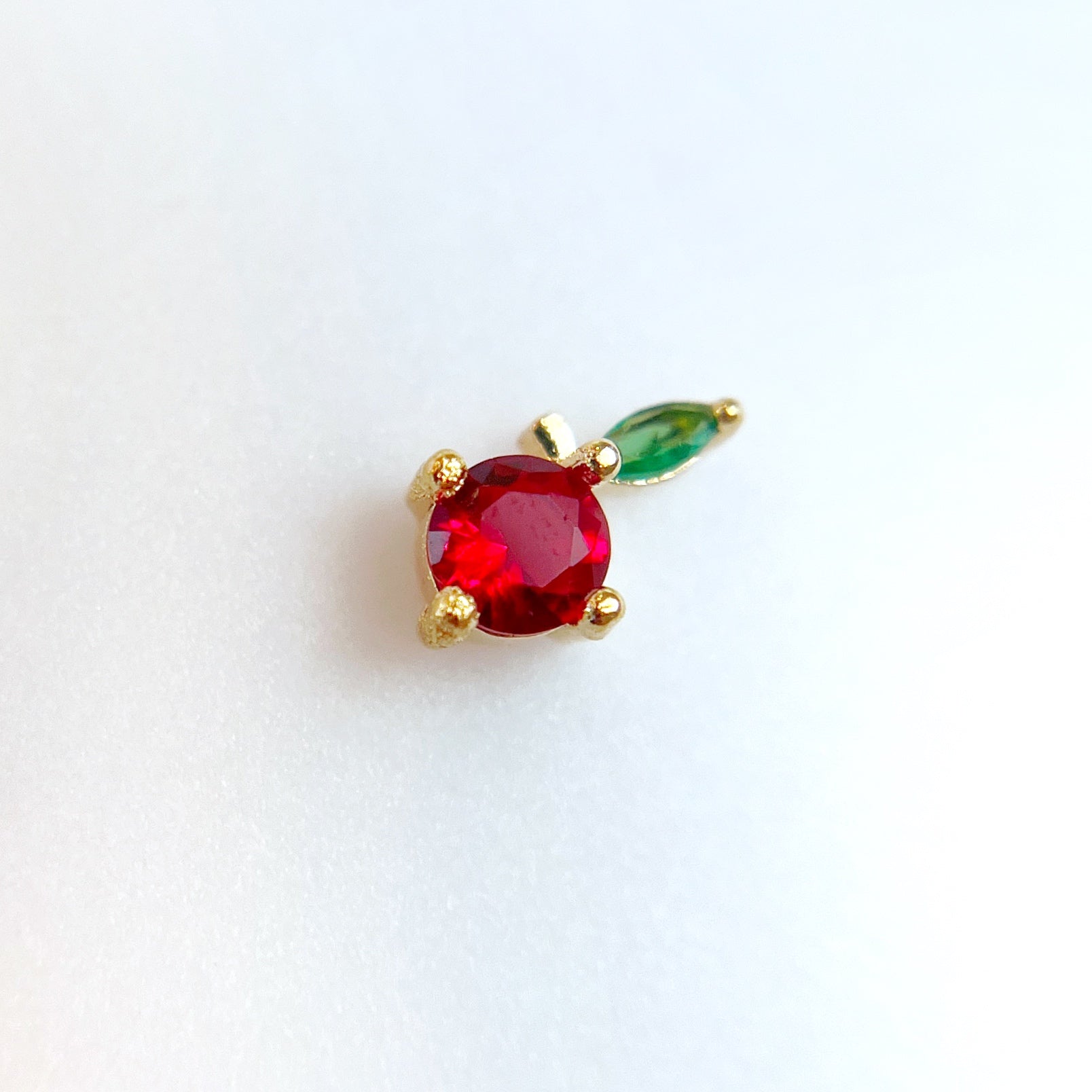 Rhinestone nail charm on white background.