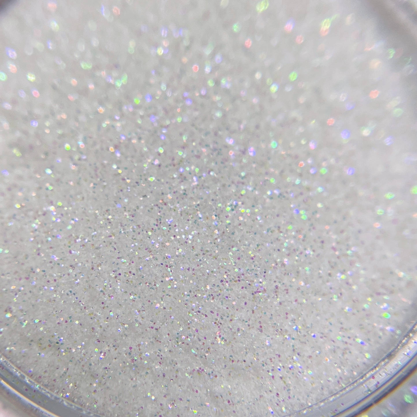 Close up of fine glitter particles in transparent jar