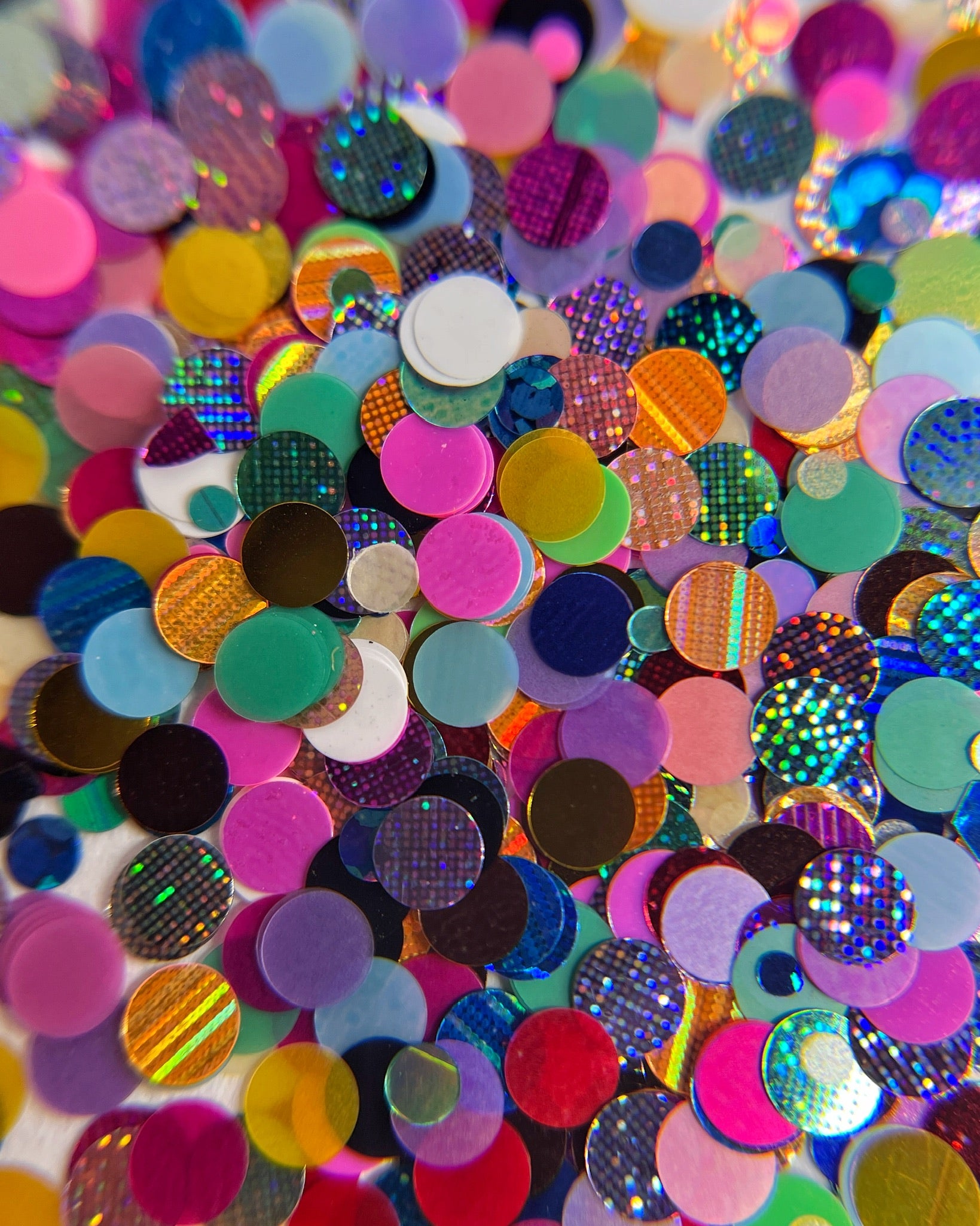 Glitter mix scattered on white background. 