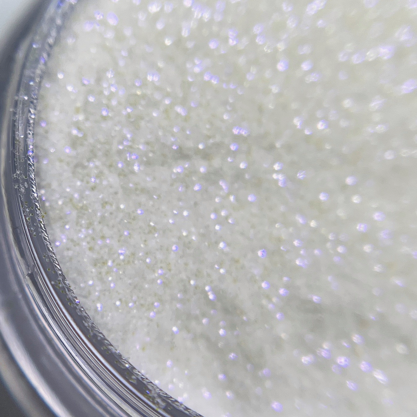 Close up of fine glitter in transparent jar