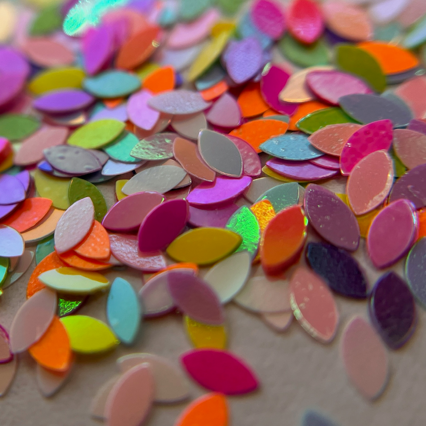 Glitter mix scattered on white background. 