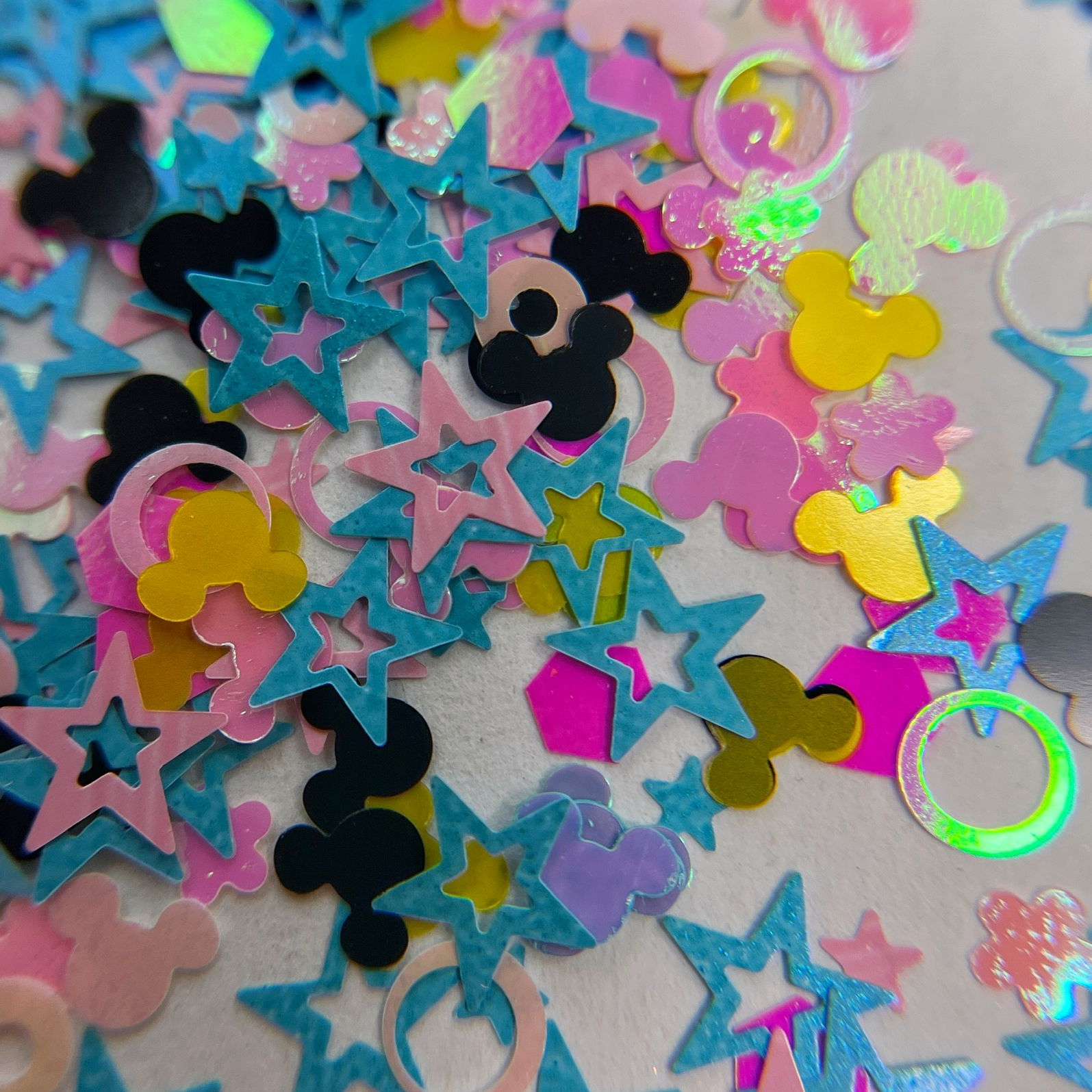 Glitter mix scattered on white background. 